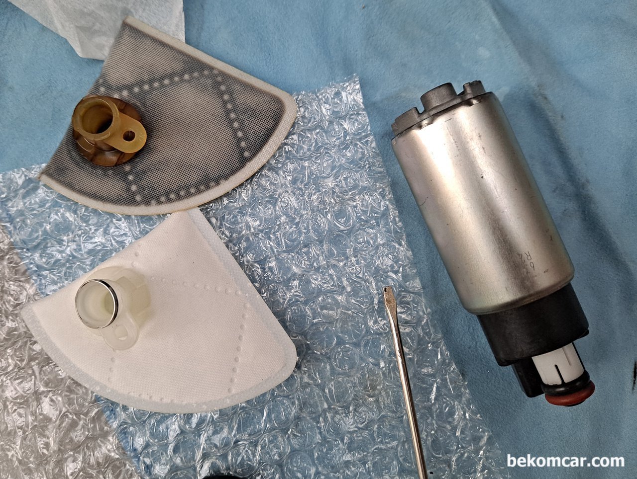 What is the 'strainer' in the fuel pump assembly?, None|bekomcar.com